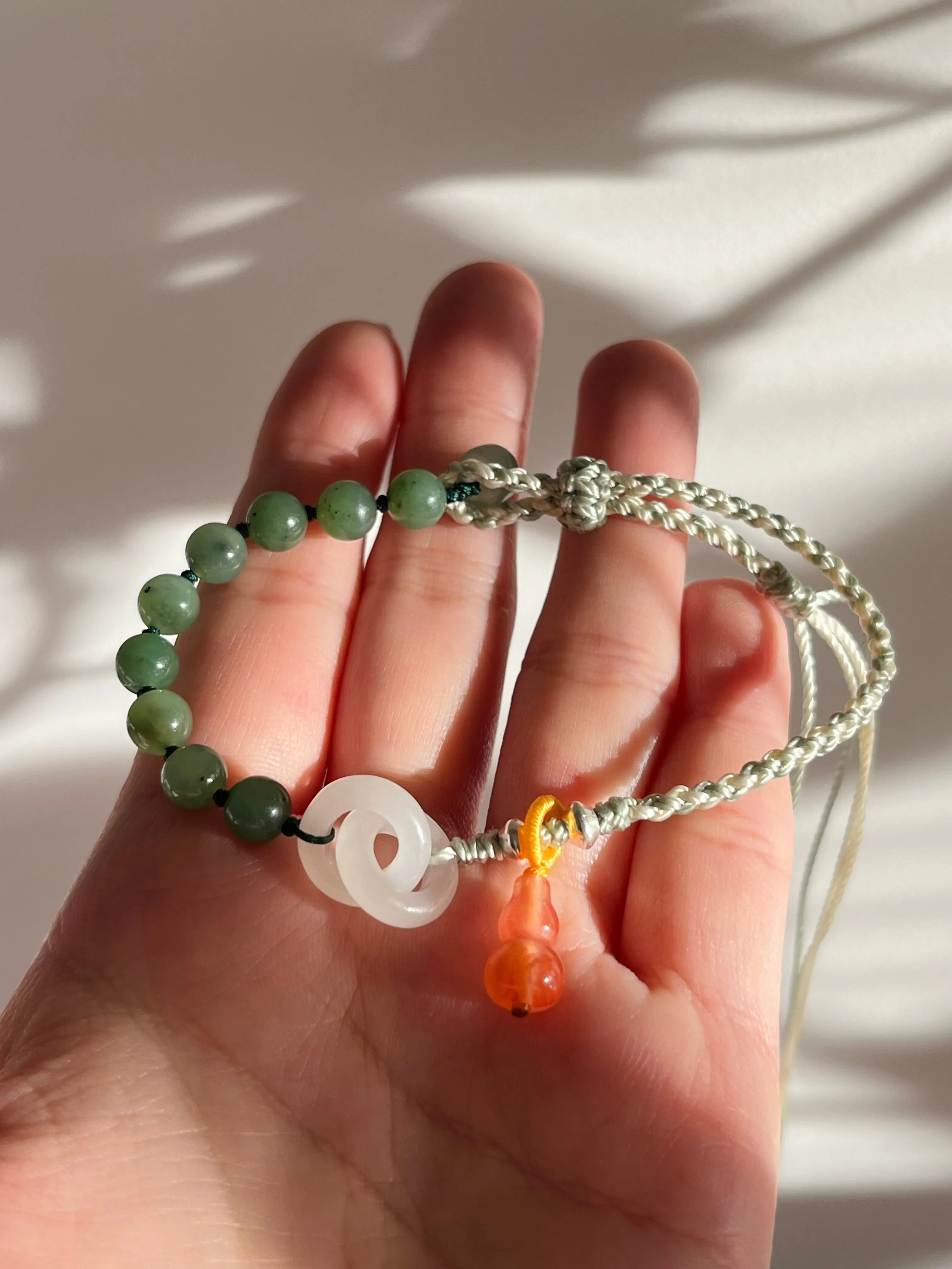 Handwoven Bracelet with Interlocking White Jade Rings, 手编和田白玉环环相扣手绳